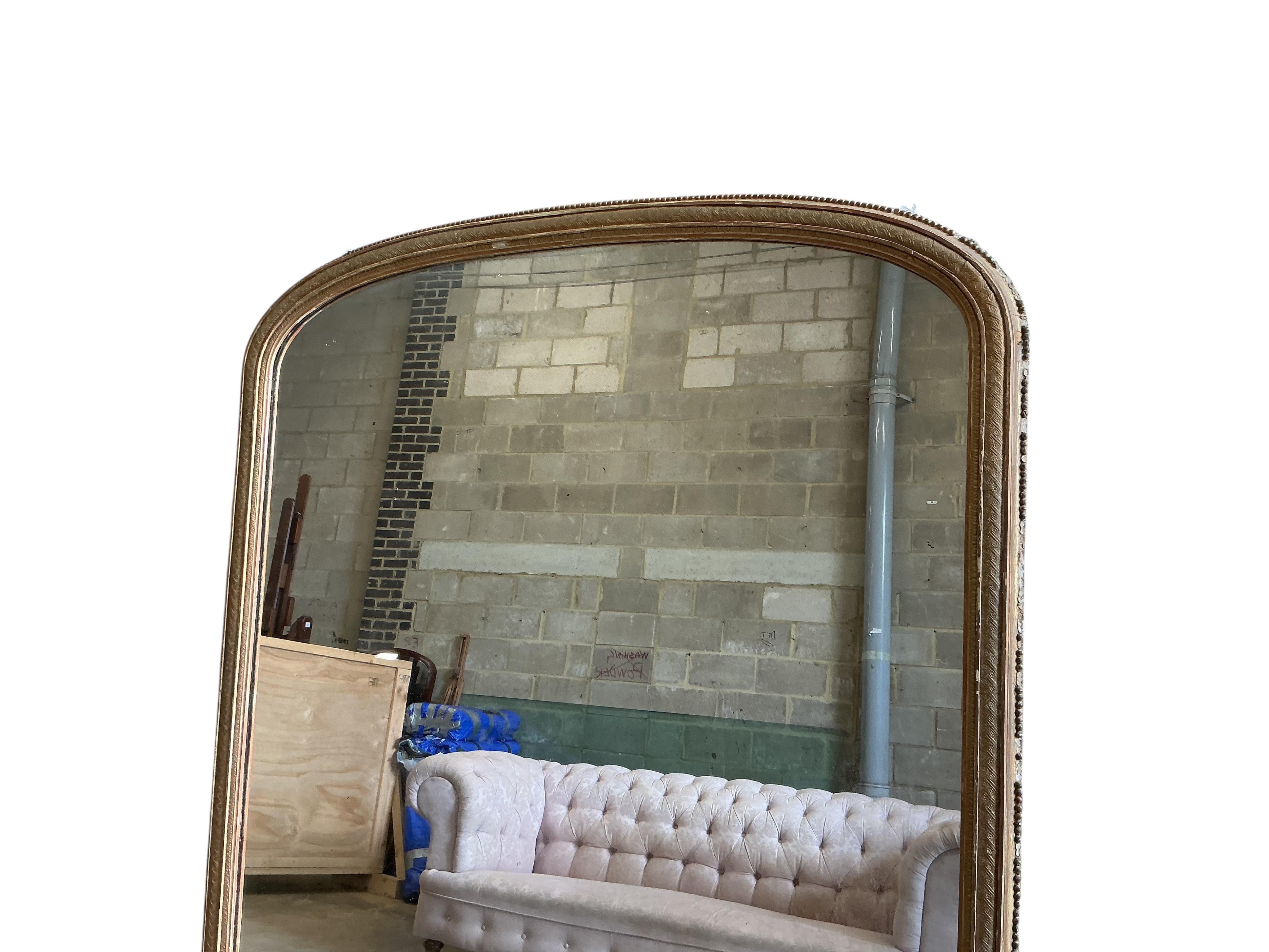 A large Victorian giltwood and composition overmantel mirror, width 160cm, height 184cm